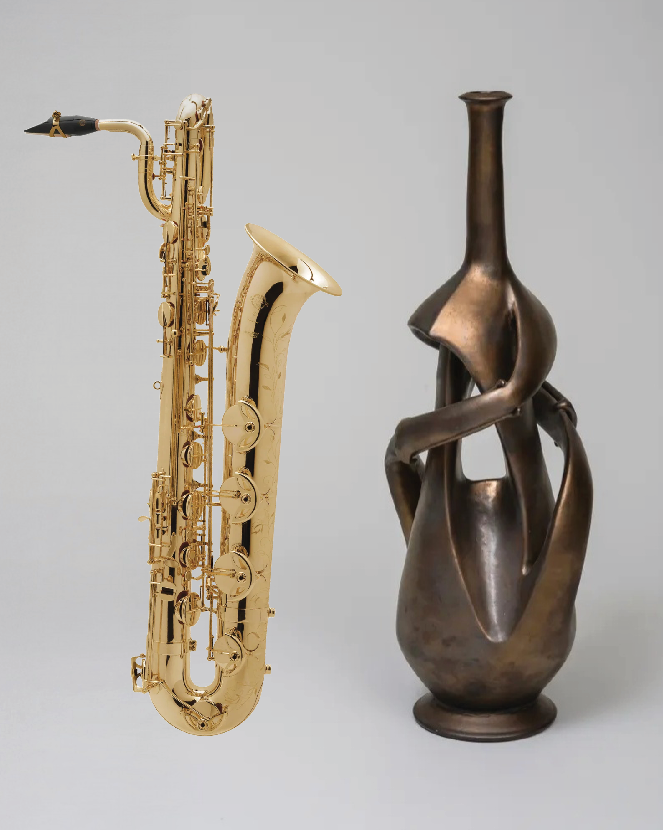 Promotional image for a Spotlight performance featuring Denis DiBlasio, Adriam Barnes and Ron Thomas. A sculpture by Skeff Thomas is pictured with a sax, right).
