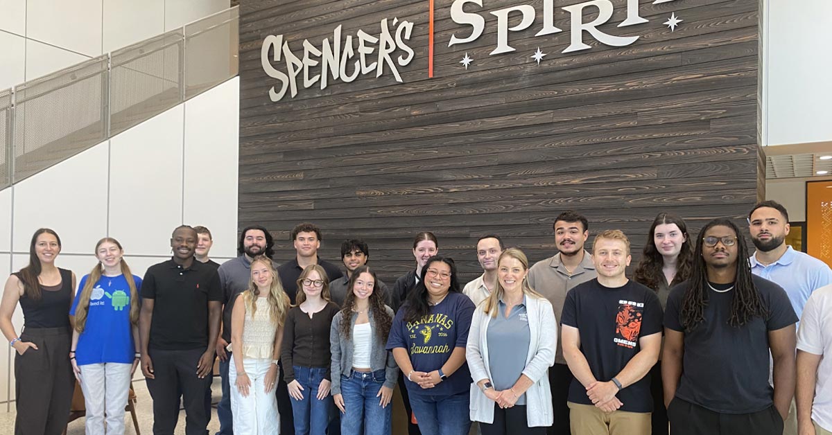 The Summer 2026 intern cohort at Spencer's and Spirit Halloween in Egg Harbor Township, pose with representatives from the Rowan Center for Professional Development.