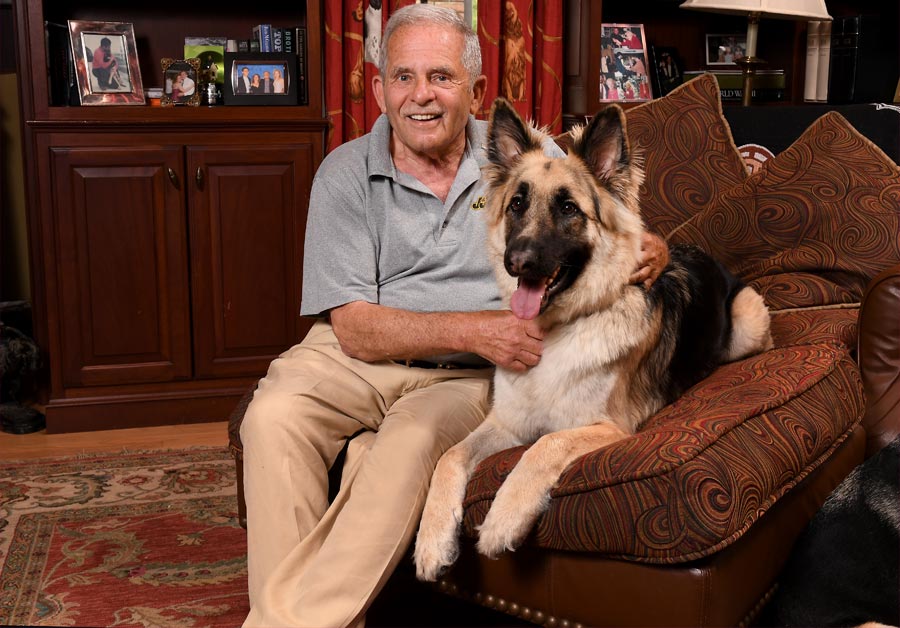 Gerry Shreiber poses with Hachi, one of his beloved rescues.